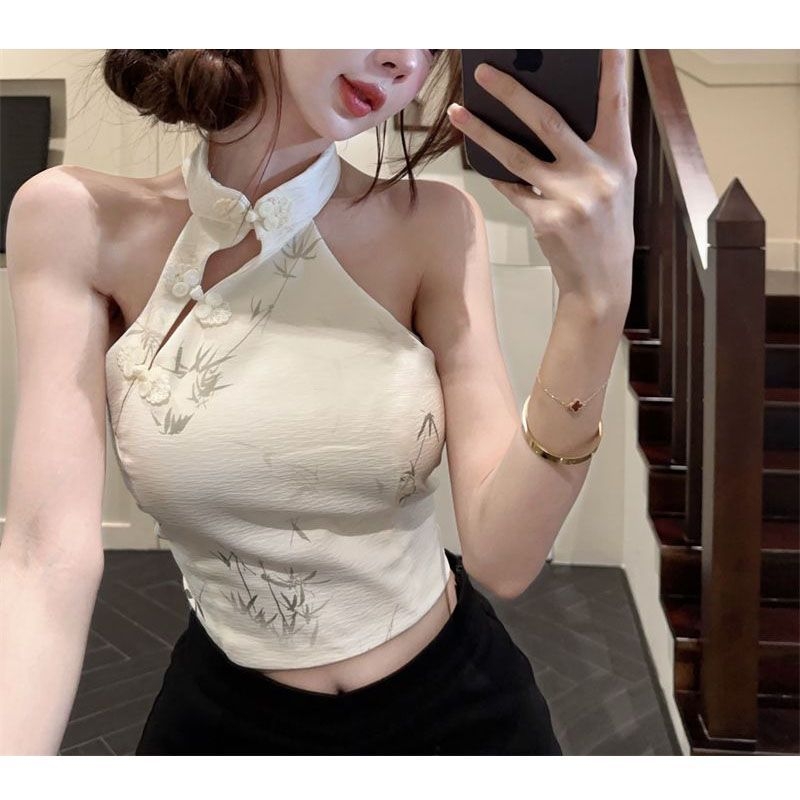 Halterneck top bez rukava, otvorena leđa, rock motiv otisak, poliester materijal, uski kroj.