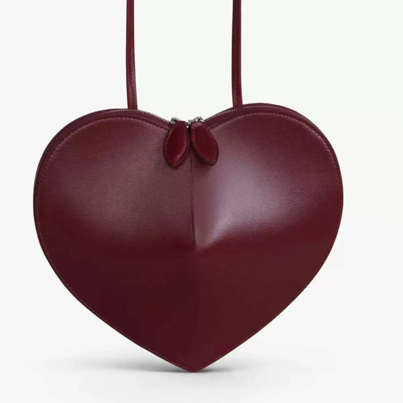 Ženska crossbody torba sa srcolikim oblikom, PU materijal, gradski minimalistički stil, zatvarač, jesen 2025