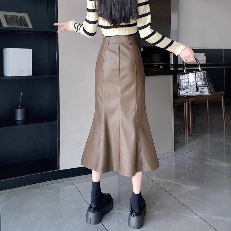 Duga PU kožna suknja s repom ribe, visokim strukom, rub s listom lotosa, jesen 2025