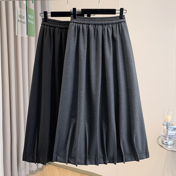 Vunena srednje duga A-linijska suknja s korejskim stilom plisiranog ruba, elastičan pojas i trodimenzionalni kroj; 70–80% pamuka, do 30% elastana.
