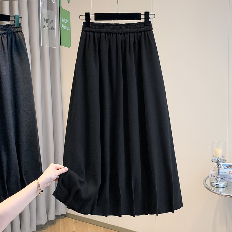 Vunena srednje duga A-linijska suknja s korejskim stilom plisiranog ruba, elastičan pojas i trodimenzionalni kroj; 70–80% pamuka, do 30% elastana.