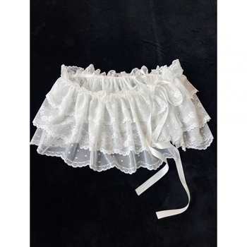 Детска мини пола с мрежеста полиестерна тъкан, нерегулярна кройка, съдържание на основна материя 71–80%, подходяща за деца над 8 години