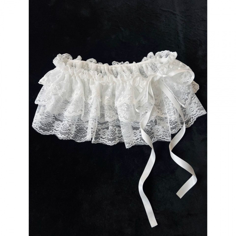 Детска мини пола с мрежеста полиестерна тъкан, нерегулярна кройка, съдържание на основна материя 71–80%, подходяща за деца над 8 години