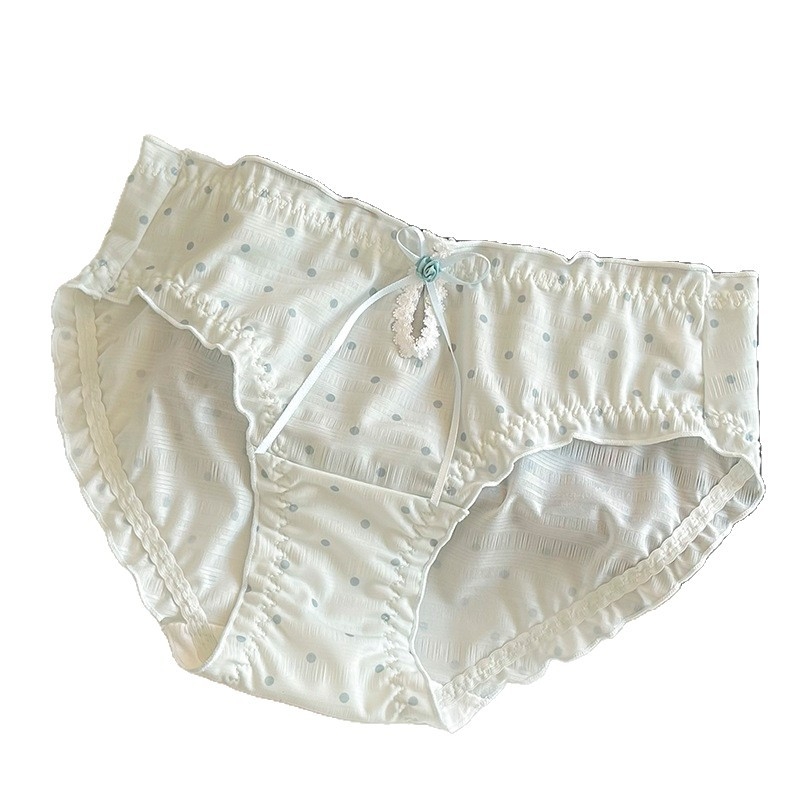 Női háromszög alakú alsónemű pöttyös mintával, középmagas derék, poliészter anyag pamuttal bélelt, lélegző és antibakteriális