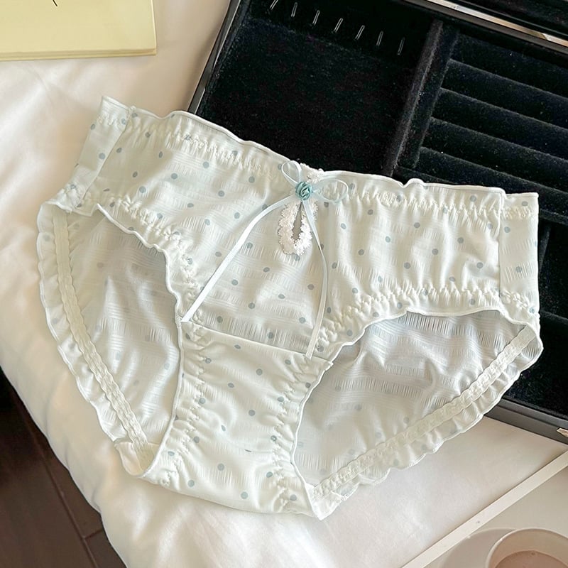 Női háromszög alakú alsónemű pöttyös mintával, középmagas derék, poliészter anyag pamuttal bélelt, lélegző és antibakteriális