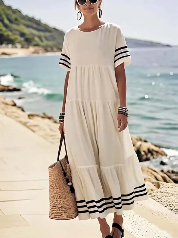 Hosszú csíkos ruha kerek nyakkal, rövid ujjú, laza derékszélesség, A-vonalú sziluett, poliészter 95%+.