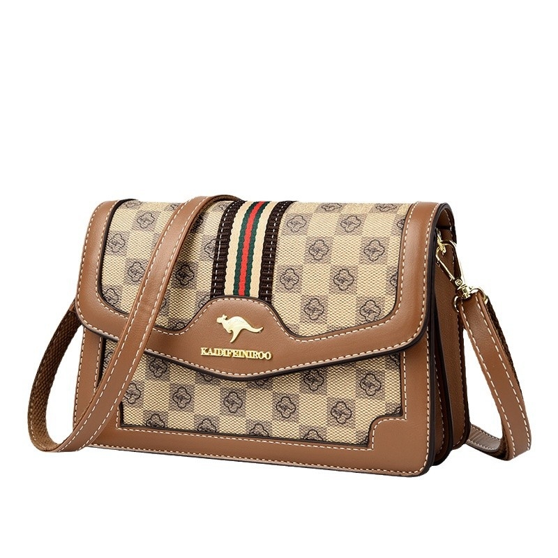 Ženska crossbody torba – mekana sintetička koža, mali kvadratični oblik, zatvaranje poklopcem, unutarnji džepovi sa zipom i džep za dokumente, dvostruke naramenice