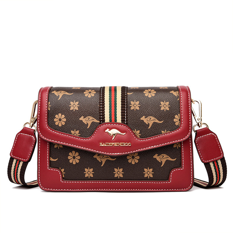 Ženska crossbody torba – mekana sintetička koža, mali kvadratični oblik, zatvaranje poklopcem, unutarnji džepovi sa zipom i džep za dokumente, dvostruke naramenice