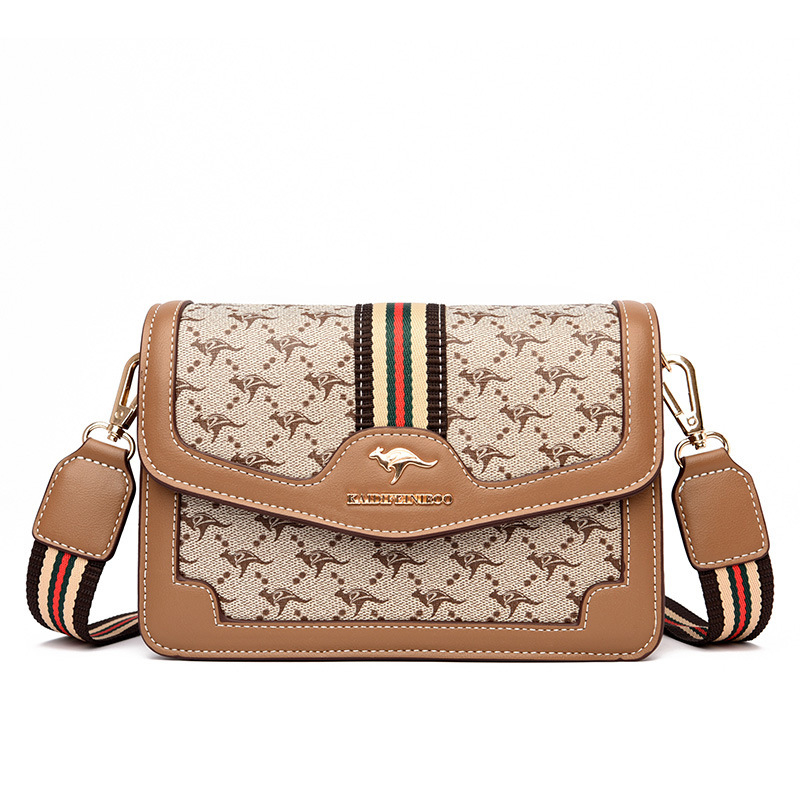 Ženska crossbody torba – mekana sintetička koža, mali kvadratični oblik, zatvaranje poklopcem, unutarnji džepovi sa zipom i džep za dokumente, dvostruke naramenice