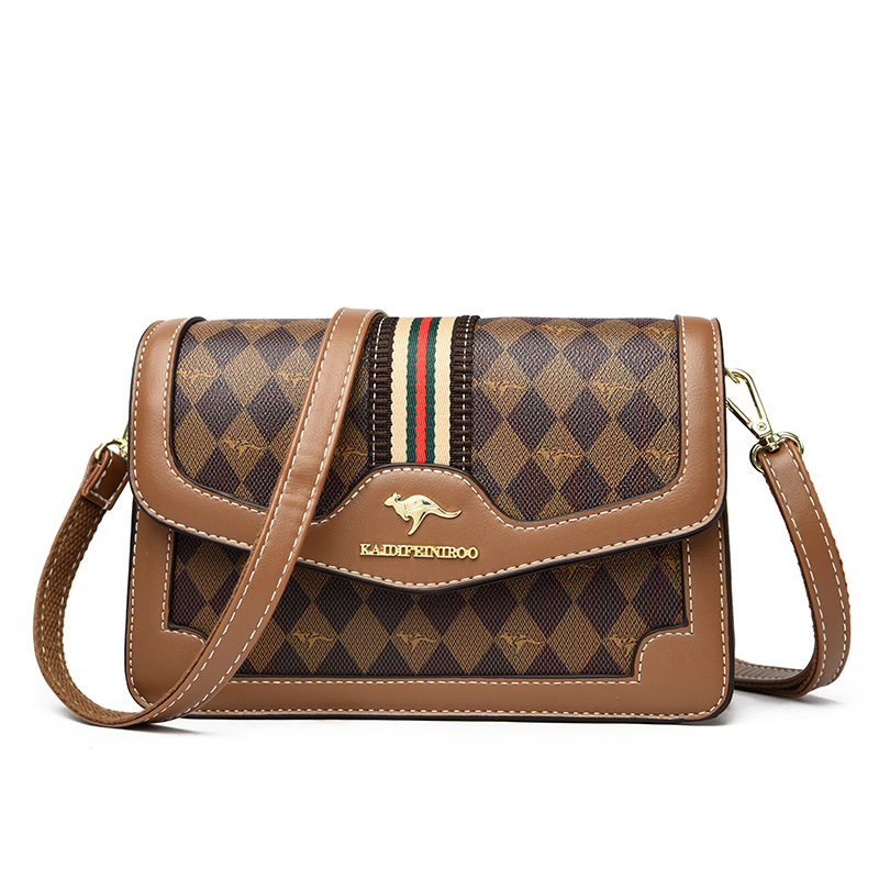 Ženska crossbody torba – mekana sintetička koža, mali kvadratični oblik, zatvaranje poklopcem, unutarnji džepovi sa zipom i džep za dokumente, dvostruke naramenice