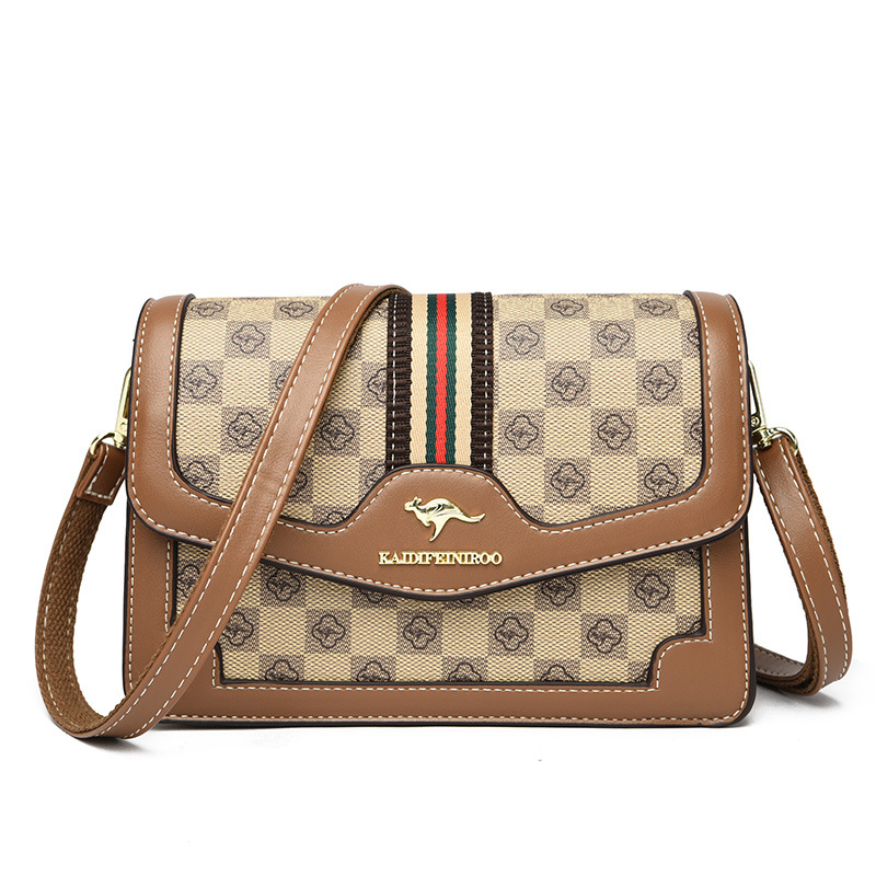 Ženska crossbody torba – mekana sintetička koža, mali kvadratični oblik, zatvaranje poklopcem, unutarnji džepovi sa zipom i džep za dokumente, dvostruke naramenice
