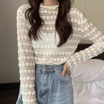 Női csipkés felső kivágott mintával és hálós alréteggel, magas gallér, hosszú ujjú, karcsú szabás, 95% poliészter