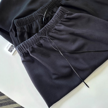 Női kötött A-vonalú szoknya, magas derekú, hátsó hasítékkal, középmagas hosszúságú, poliészter és elasztán