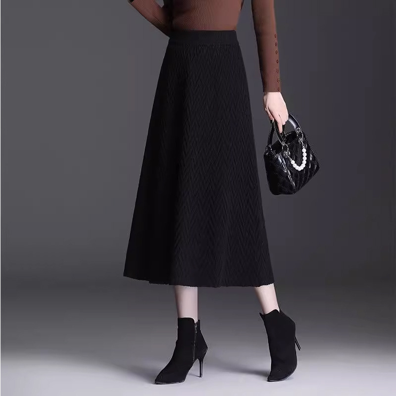 A-образна плетена пола до миди дължина, висока талия с ластик, плат смес найлон и полиестер (50-70% найлон, под 30% полиестер), микроеластична, елегантен стил за ежедневие