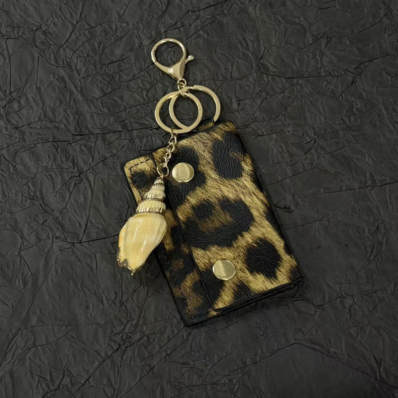 Breloc za ključeve s leopard uzorkom i metalnim kućištem, mali dodatak za torbicu, stil 2-u-1. Materijal: Miješani materijali; Obrada: Poluručna; Uzorak: Morski život; Godina/Sezona: Zima 2025