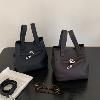 Ancient Charm gradska minimalistička bucket bag od prave kože sa zaključavanjem kopčom