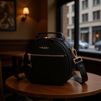 Γυναικεία τσάντα χιαστί με ανάγλυτο δέρμα, μικρού κυκλικού σχήματος, με φερμουάρ, αποσπώμενο ιμάντα, θήκη τηλεφώνου