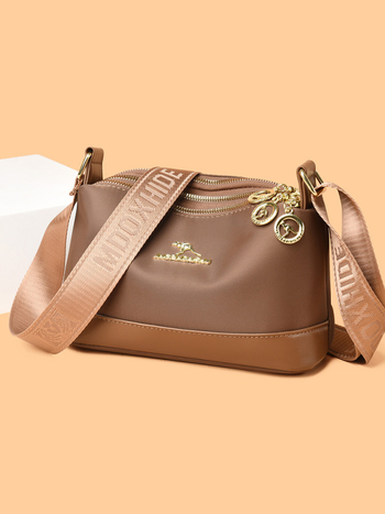 Ženska crossbody torba od Oxford platna, horizontalno kvadratnog oblika, zatvaranje na zip, poliester podstava, unutarnji džepovi: džep sa zipom, džep za telefon i džep za ID