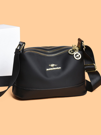 Ženska crossbody torba od Oxford platna, horizontalno kvadratnog oblika, zatvaranje na zip, poliester podstava, unutarnji džepovi: džep sa zipom, džep za telefon i džep za ID