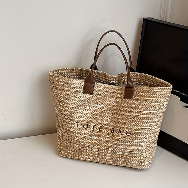 Torba tote od slame s izvezenim slovima, gradski minimalistički stil (materijal: slama; vodoravni kvadratni oblik; magnetsko zatvaranje; unutarnja džep sa zipom)