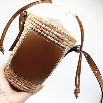 Saint-Jay Geantă cilindrică din raffia, închidere prin șnur, căptușeală din bumbac, buzunar exterior deschis