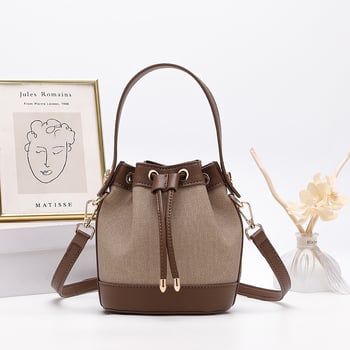 Τσάντα crossbody κυλινδρικού σχήματος από microfiber συνθετικό δέρμα, άνοιγμα με ταινία, εσωτερική τσέπη με φερμουάρ, αστικό μινιμαλιστικό στυλ