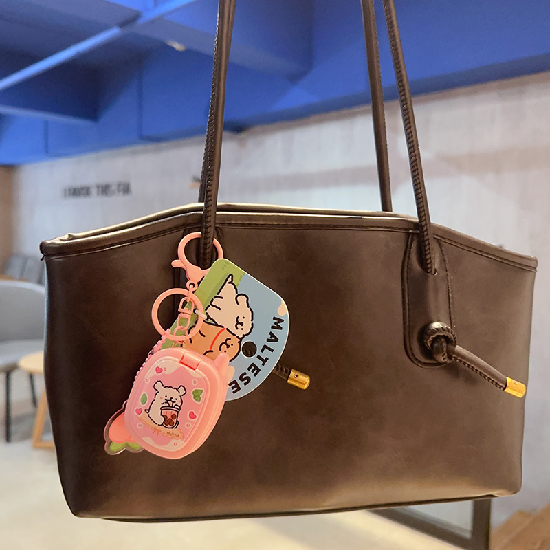 Ключодържател с мило линейно кученце в ретро преносима игрова конзола, индивидуално опакован – подходящ като бизнес подарък