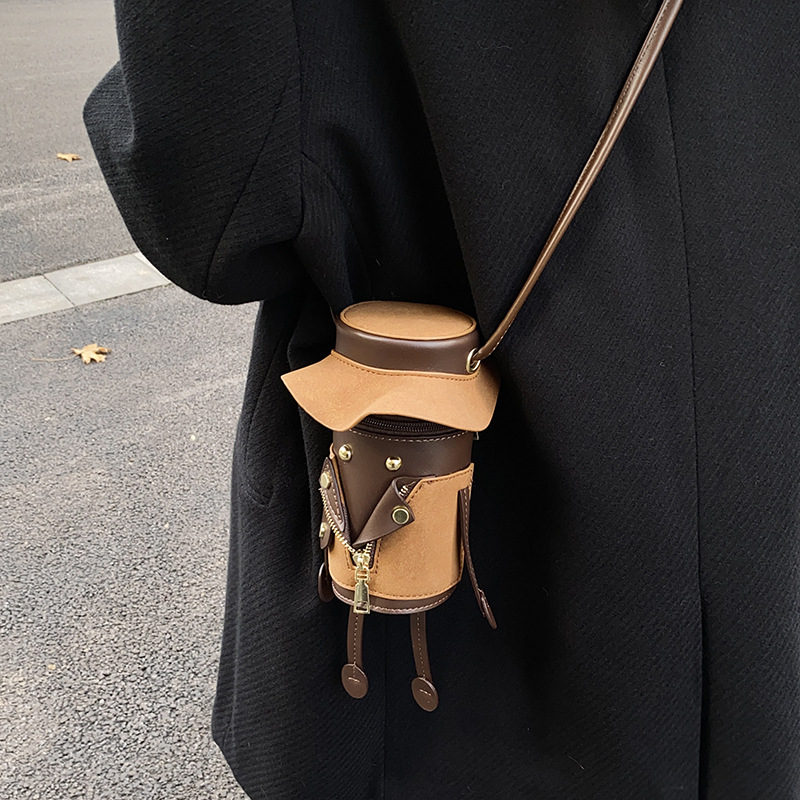 Bucket bag Yuzuo, cilindrična PU torba s retro naglaskom, poklopcem i džepom za telefon – ljeto 2025