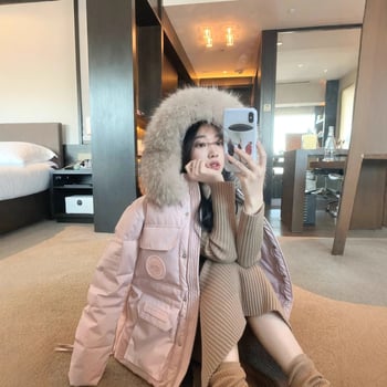 Дамско пухено парке с качулка и неразмъкваща се яка от козина енот - 201–300 g пух, 85–90% съдържание на пух, средна дължина 65–80 cm, водоустойчив полиестер