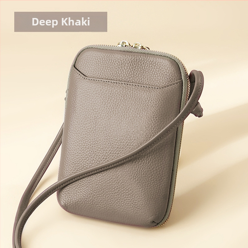 Női mobiltelefon táska keresztpánttal, valódi bőr, első réteg marha bőréből, cipzáras nyitás, függőleges négyzetes forma, belső cipzáras rekesz és kártyatartóhelyek