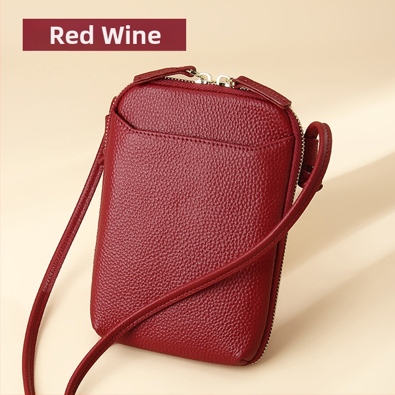 Női mobiltelefon táska keresztpánttal, valódi bőr, első réteg marha bőréből, cipzáras nyitás, függőleges négyzetes forma, belső cipzáras rekesz és kártyatartóhelyek