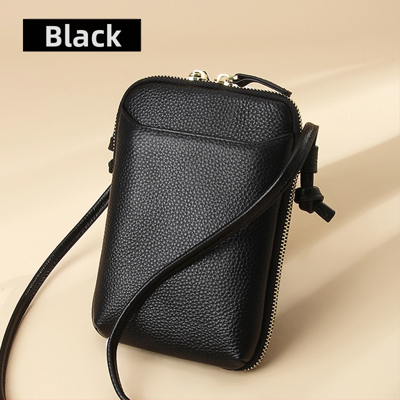 Női mobiltelefon táska keresztpánttal, valódi bőr, első réteg marha bőréből, cipzáras nyitás, függőleges négyzetes forma, belső cipzáras rekesz és kártyatartóhelyek