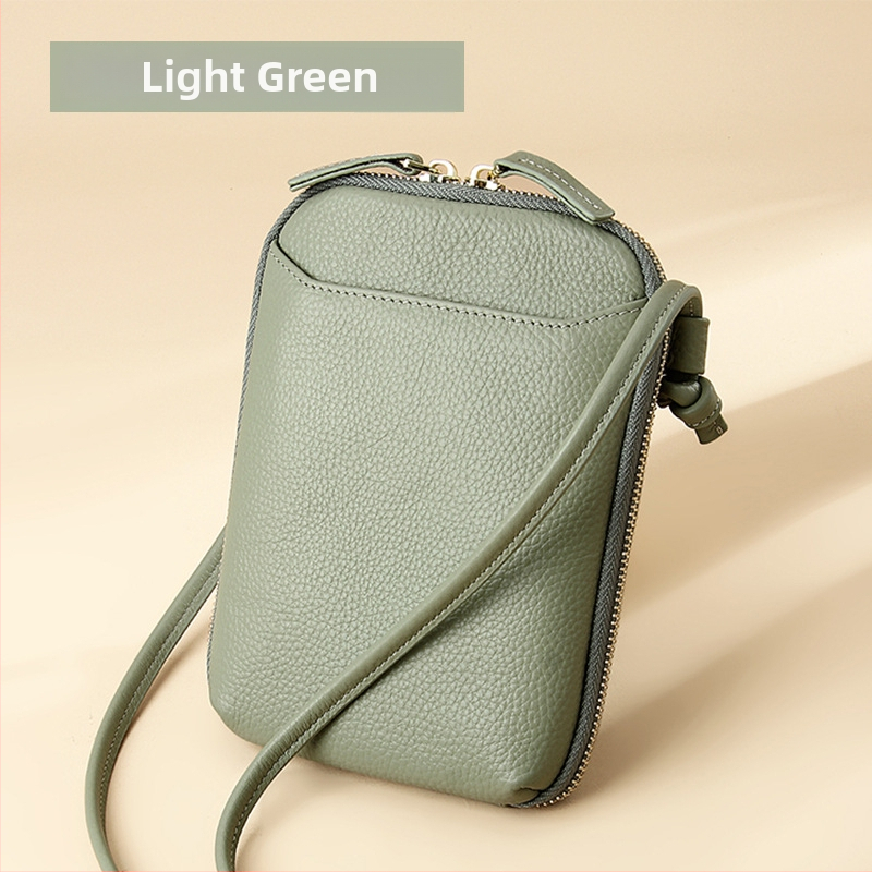 Női mobiltelefon táska keresztpánttal, valódi bőr, első réteg marha bőréből, cipzáras nyitás, függőleges négyzetes forma, belső cipzáras rekesz és kártyatartóhelyek