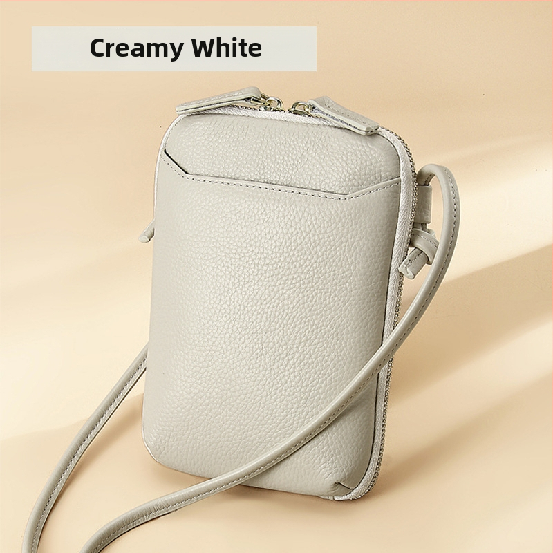 Női mobiltelefon táska keresztpánttal, valódi bőr, első réteg marha bőréből, cipzáras nyitás, függőleges négyzetes forma, belső cipzáras rekesz és kártyatartóhelyek