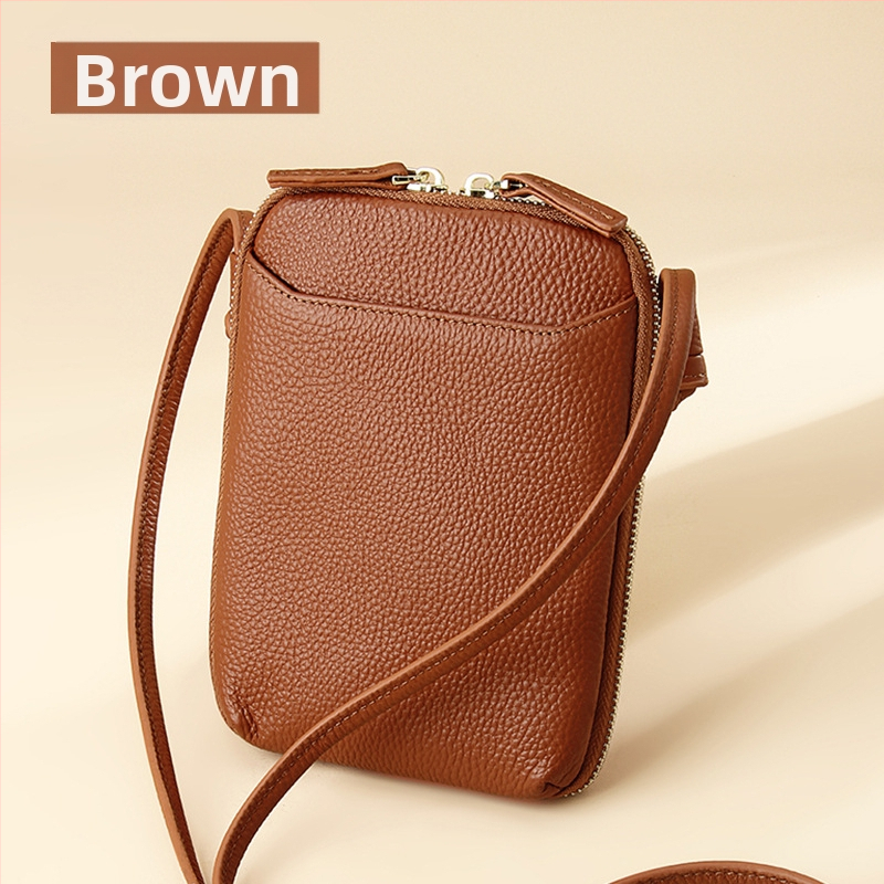 Női mobiltelefon táska keresztpánttal, valódi bőr, első réteg marha bőréből, cipzáras nyitás, függőleges négyzetes forma, belső cipzáras rekesz és kártyatartóhelyek