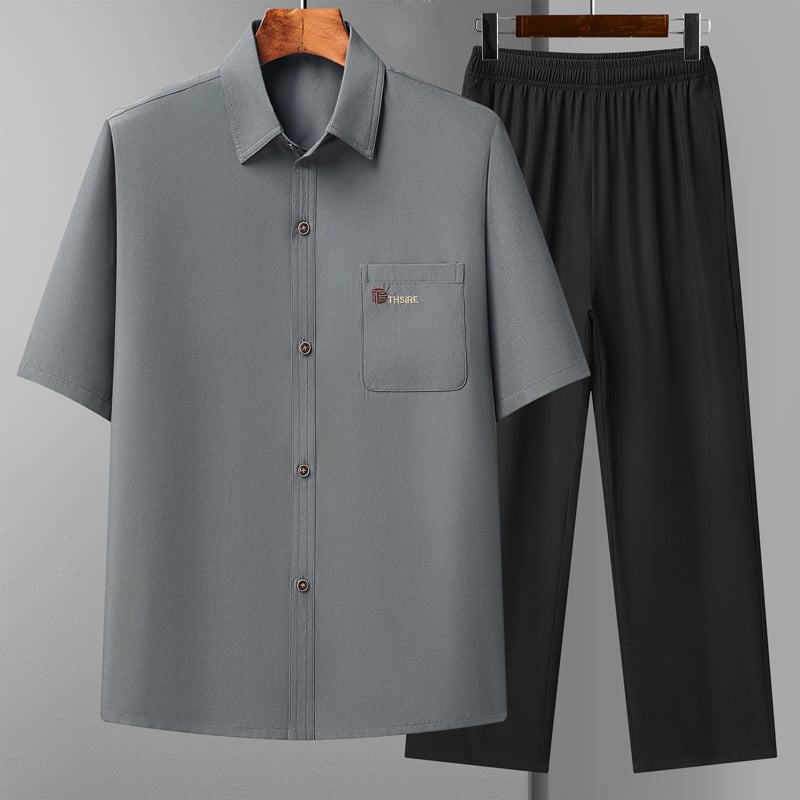 Риза с тесен силует, къс ръкав, яка тип лафел, полиестерна тъкан, едноцветен модел