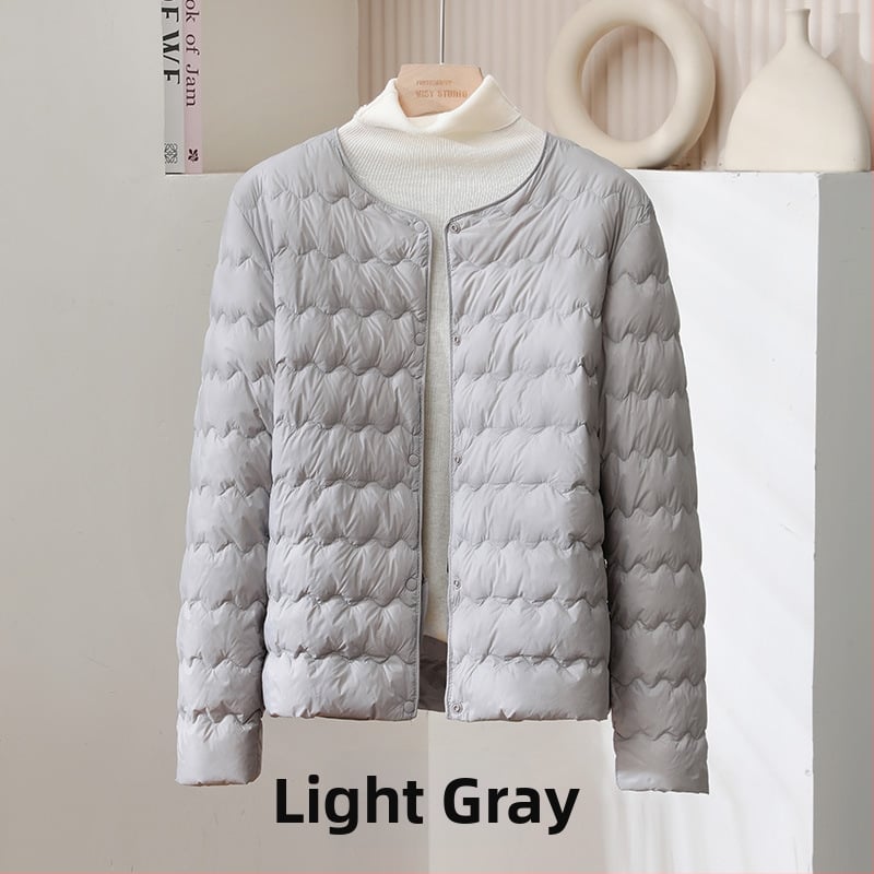 Дамско пухено яке, тънък силует, ултра къс модел (≤40 см), пълнено с пух от патица, съдържание на пера 51–55%