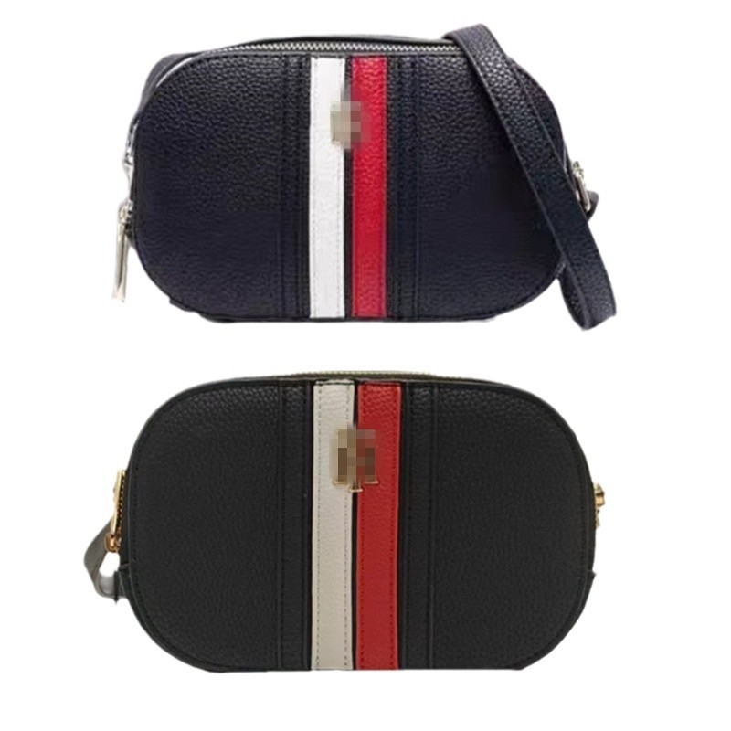Ženska crossbody torbica - cilindrični oblik, otvor na zip, unutarnja džep s zipom, meka materija, jedna naramenica, ljeto 2024
