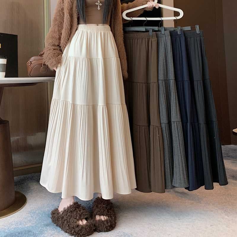 A-line vlnená sukňa, sukňa typu dážnik, vysoký pás, dlhá, textúra s vráskami, zima 2025, elegantný pracovný štýl