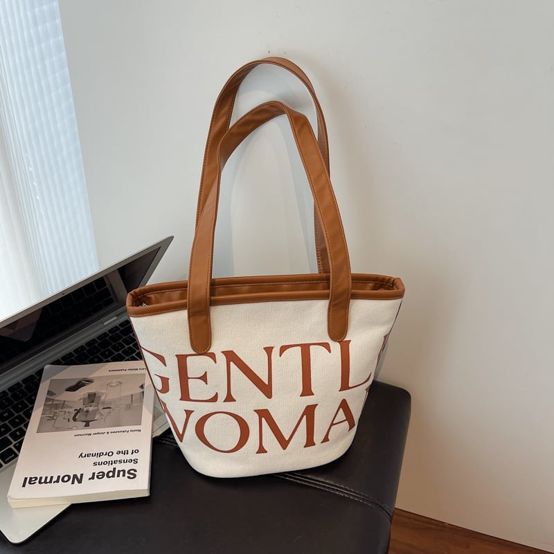 Platnena torba-kanta sa zatvaračem, bucket-stil, dvije naramenice, unutarnji džepovi za telefon i dokumente