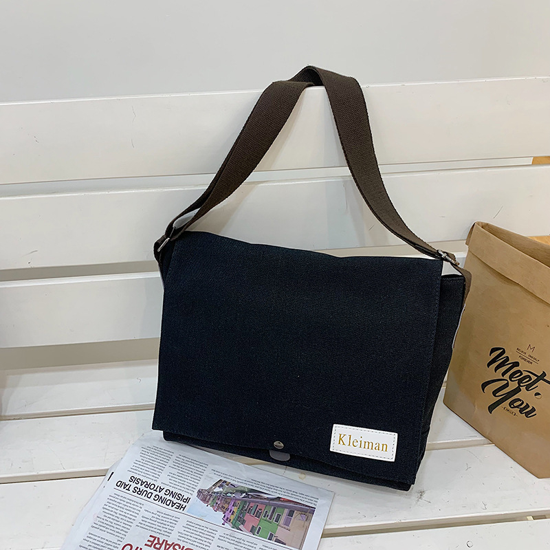 Muška platnena crossbody torba, japanskog stila, proširivi dizajn, pogodna za 8-inčni prijenosnik, poliester podstava.