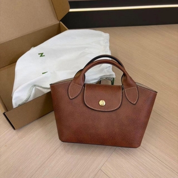 Urban minimalist PU tote torba, dumpling oblik s preklopom, platnena podstava, unutarnji džepovi sa zipom, jedna naramenica, proljeće 2025
