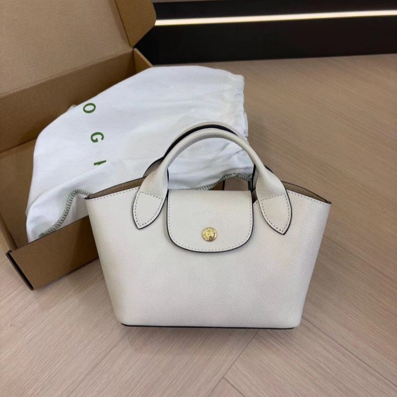 Urban minimalist PU tote torba, dumpling oblik s preklopom, platnena podstava, unutarnji džepovi sa zipom, jedna naramenica, proljeće 2025