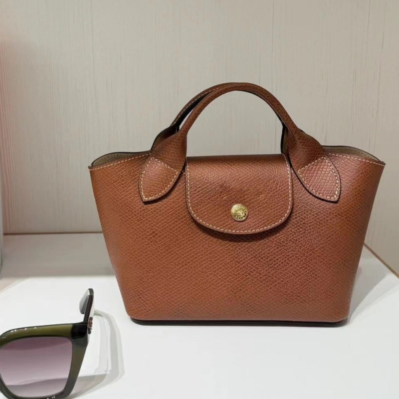 Urban minimalist PU tote torba, dumpling oblik s preklopom, platnena podstava, unutarnji džepovi sa zipom, jedna naramenica, proljeće 2025