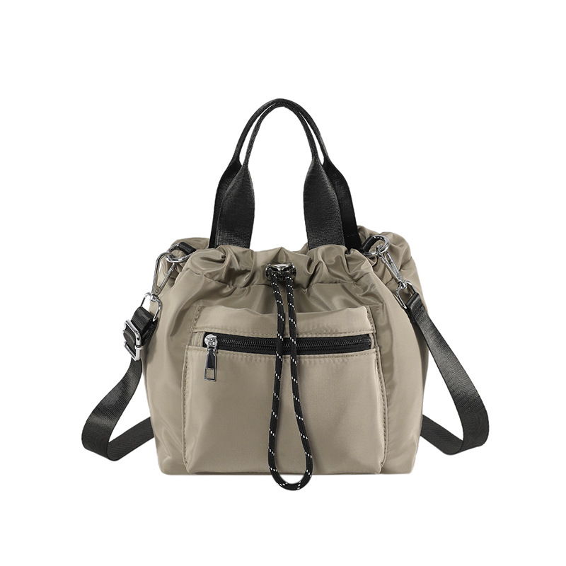 Ženska nylon torba tipa bucket, gradski minimalistički dizajn, oblik košare sa zatvaračem