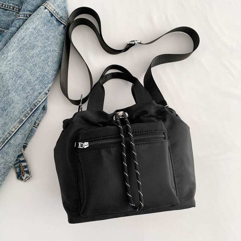 Ženska nylon torba tipa bucket, gradski minimalistički dizajn, oblik košare sa zatvaračem
