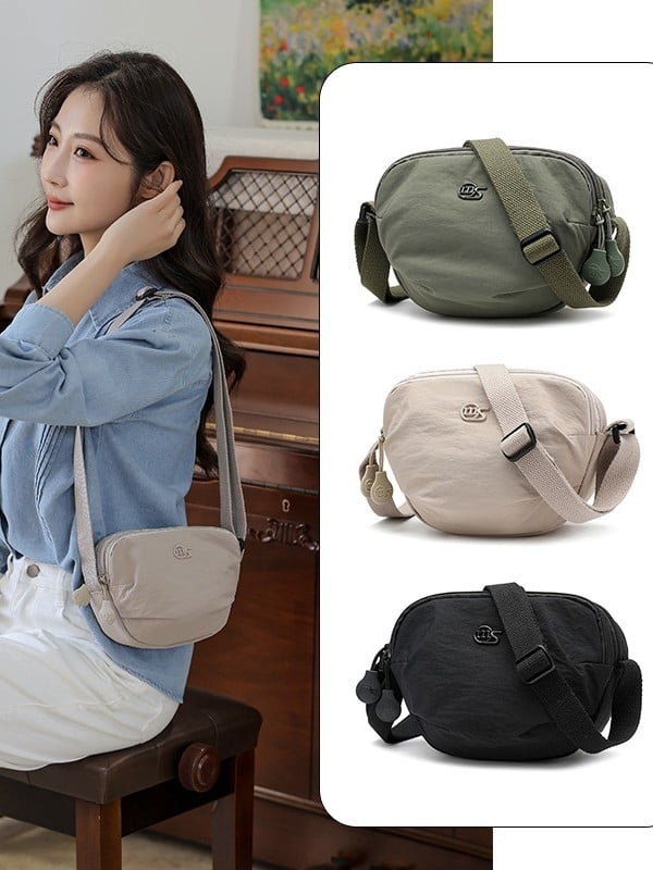 Ženska crossbody torba od Oxford platna, nylon podstava, zatvaranje na zip, unutarnja džep s zipom, trodimenzionalni dizajn