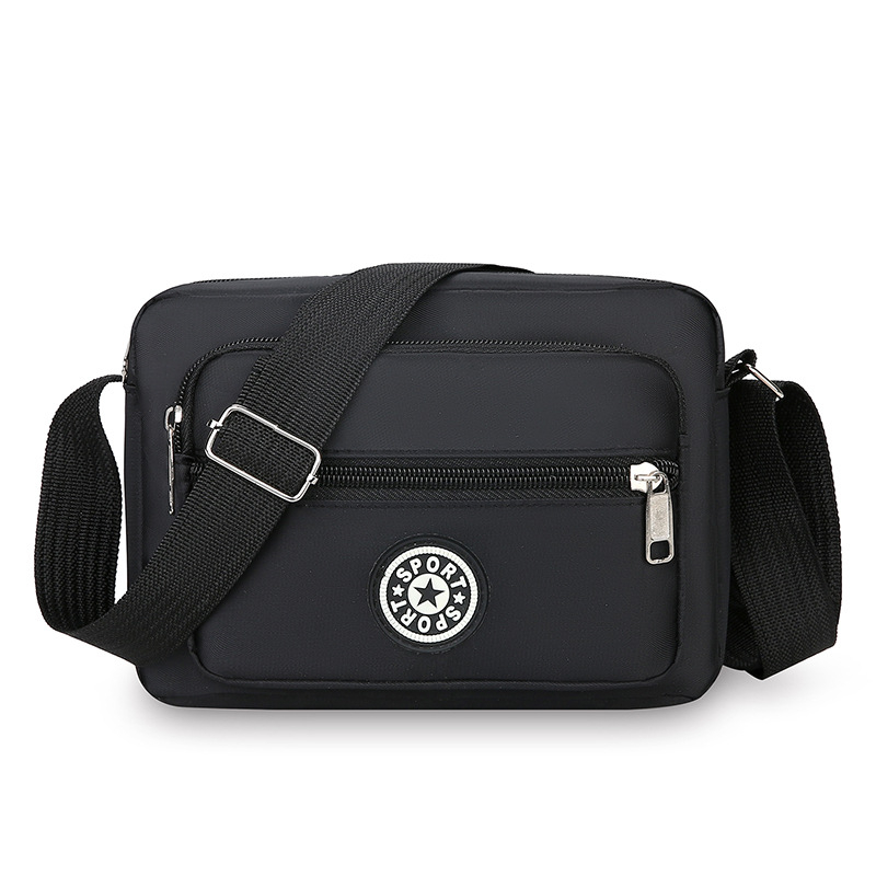 Crossbody torba od Oxford platna, kompaktna kvadratna forma, sa zatvaračem i pretincima za telefon i dokumente