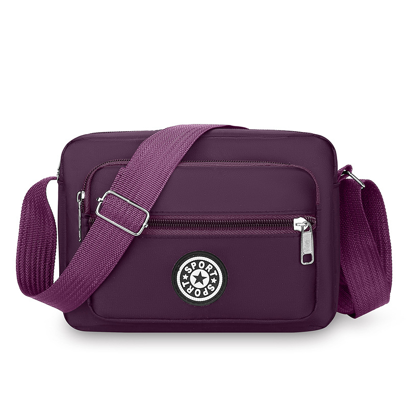 Crossbody torba od Oxford platna, kompaktna kvadratna forma, sa zatvaračem i pretincima za telefon i dokumente
