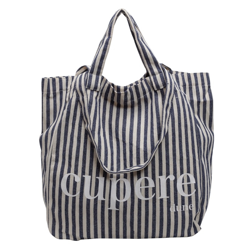 Geantă tote din canvas, stil street-trend, închidere cu lacăt, căptușeală din poliester, curele de umăr duble